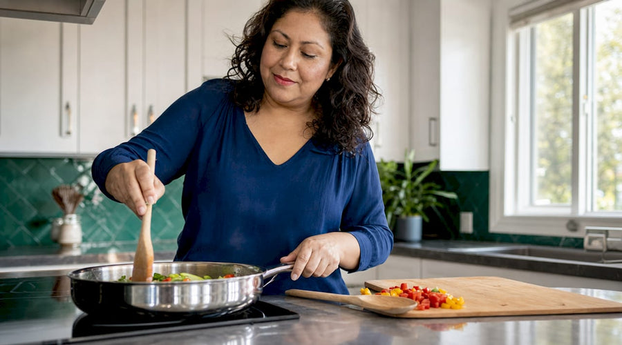 Woman cooking with stainless steel pan at stove