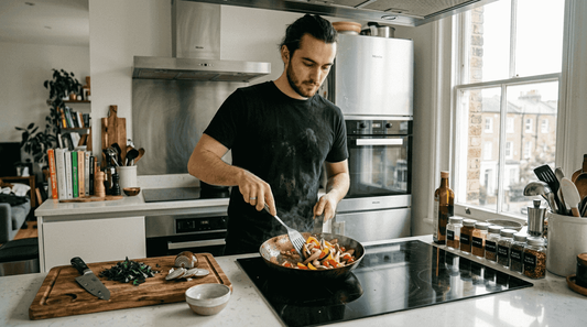 Chef cooking with carbon steel on induction