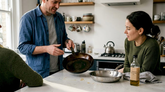Cook showing seasoned carbon steel pan